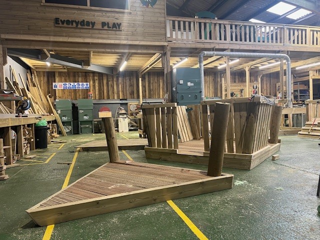 Boat being built 1 Workshop view of wooden boat playground equipment under construction, showcasing craftsmanship and quality.