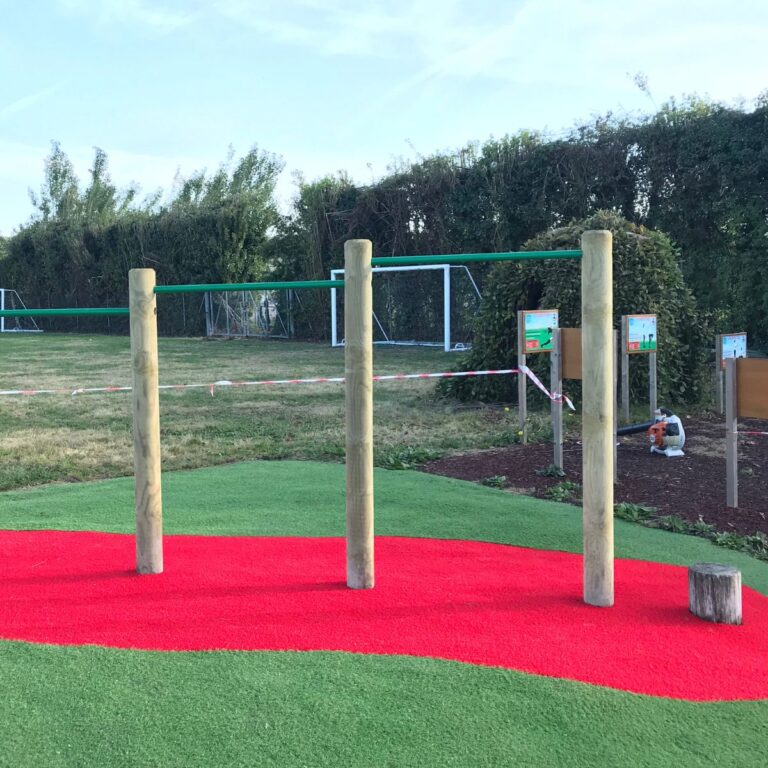 red splash under a trim trail -Wetpour Safety Surfacing