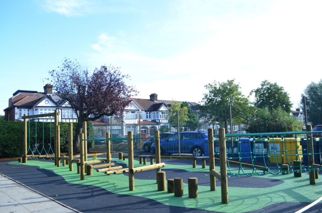 Barley Lane School Obstacle Course - Wooden Trim Trail by Everyday Play with green wetpour safety surface