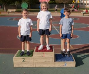 Children on School Sports Wooden Podium